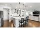 Modern kitchen featuring gray cabinets, a white countertop island, and stainless steel appliances at 272 High Woods Rdg, Chapel Hill, NC 27517