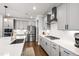 Stylish kitchen with stainless steel appliances, gray cabinetry, and white countertops at 272 High Woods Rdg, Chapel Hill, NC 27517