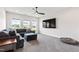 Relaxing living room showcasing a comfortable sectional sofa, large TV, and natural light at 272 High Woods Rdg, Chapel Hill, NC 27517
