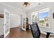 Well-lit office space with stylish lighting, a large window, and French doors at 272 High Woods Rdg, Chapel Hill, NC 27517