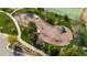Aerial view of a playground surrounded by greenery and trees, offering a recreational space at 272 High Woods Rdg, Chapel Hill, NC 27517
