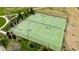 Aerial view of well-maintained tennis courts, surrounded by trees at 272 High Woods Rdg, Chapel Hill, NC 27517