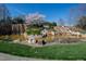 Picturesque waterfall feature with lush greenery and serene pond in a parklike setting at 272 High Woods Rdg, Chapel Hill, NC 27517