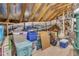 Large attic space for storage with exposed wooden beams, insulated walls, and storage containers at 30 Sawtooth Oak Ln, Youngsville, NC 27596