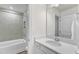 Bathroom featuring a tub-shower combination with white tile surround at 30 Sawtooth Oak Ln, Youngsville, NC 27596
