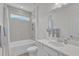 Bright bathroom featuring a shower-tub combination and a white quartz countertop vanity at 30 Sawtooth Oak Ln, Youngsville, NC 27596