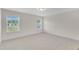 Bedroom with carpet, white walls and two large windows for natural light at 30 Sawtooth Oak Ln, Youngsville, NC 27596