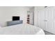 Comfortable bedroom featuring a double door closet, plush carpet, and a TV at 30 Sawtooth Oak Ln, Youngsville, NC 27596