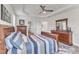 Bedroom with tray ceilings, ceiling fan and a coordinating bedspread and furniture at 30 Sawtooth Oak Ln, Youngsville, NC 27596