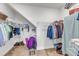 Walk in closet with wire shelving and a variety of hanging clothes at 30 Sawtooth Oak Ln, Youngsville, NC 27596