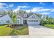 Beautiful home featuring a two-car garage, manicured lawn and lovely curb appeal at 30 Sawtooth Oak Ln, Youngsville, NC 27596