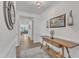 Inviting hallway with wooden floors, console table, and a view to the living space at 30 Sawtooth Oak Ln, Youngsville, NC 27596