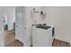 Functional laundry area with a modern washing machine and ample storage space at 30 Sawtooth Oak Ln, Youngsville, NC 27596