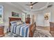 Bright bedroom with a tray ceiling, natural light, and ensuite bathroom entrance at 30 Sawtooth Oak Ln, Youngsville, NC 27596