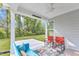 Covered outdoor patio overlooking a large yard and wooded area, featuring a ceiling fan at 30 Sawtooth Oak Ln, Youngsville, NC 27596