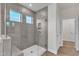 Modern glass enclosed shower with tile surround and multiple shower heads at 30 Sawtooth Oak Ln, Youngsville, NC 27596