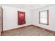 Bedroom with new flooring, a window, and base trim, creating a comfortable and stylish space at 3301 Amherst Rd, Rocky Mount, NC 27804