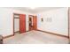 Simple bedroom with carpet, closet, neutral walls, and wood trim at 3301 Amherst Rd, Rocky Mount, NC 27804