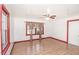 Bright bedroom featuring wood floors, and windows with decorative curtains at 3301 Amherst Rd, Rocky Mount, NC 27804