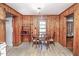 Charming dining area featuring wood paneling and a modern vinyl floor at 3301 Amherst Rd, Rocky Mount, NC 27804