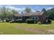 Charming single-story brick home featuring a well-maintained lawn and traditional architectural details at 3301 Amherst Rd, Rocky Mount, NC 27804