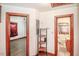 Hallway with hardwood trim showcasing access to the bedrooms and bathrooms in the home at 3301 Amherst Rd, Rocky Mount, NC 27804