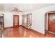 Spacious living room featuring hardwood floors, a ceiling fan, and natural light from the window at 3301 Amherst Rd, Rocky Mount, NC 27804