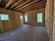 Unfinished bedroom shows new construction with multiple windows and natural light at 332 Inspiration Way, Fuquay Varina, NC 27526