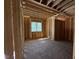 Unfinished bedroom displays framing, window at 332 Inspiration Way, Fuquay Varina, NC 27526