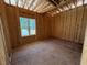 Unfinished room framed, showing framing and a window at 332 Inspiration Way, Fuquay Varina, NC 27526