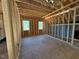 Unfinished room featuring framing and windows at 332 Inspiration Way, Fuquay Varina, NC 27526