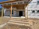 Unfinished brick front porch with visible architectural details and covered entrance at 332 Inspiration Way, Fuquay Varina, NC 27526