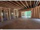 Unfinished living room shows new construction with sliding glass doors at 332 Inspiration Way, Fuquay Varina, NC 27526