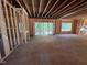 Unfinished living room shows new construction with sliding glass doors at 332 Inspiration Way, Fuquay Varina, NC 27526