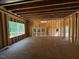 Unfinished living room with large window shows new construction with open floor plan at 332 Inspiration Way, Fuquay Varina, NC 27526