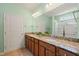 Bathroom boasts dual sinks, granite counters, and ample vanity storage at 340 Orbison Dr, Cary, NC 27519