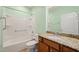 Well-lit bathroom featuring granite countertop vanity and a shower-tub combination at 340 Orbison Dr, Cary, NC 27519