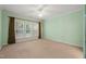 Spacious bedroom with neutral carpet, ceiling fan, and natural light at 340 Orbison Dr, Cary, NC 27519