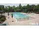 Large outdoor pool with lounge chairs and umbrellas, perfect for relaxing and enjoying the sun at 340 Orbison Dr, Cary, NC 27519