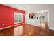 Well-lit dining room with hardwood floors and view into the kitchen area at 340 Orbison Dr, Cary, NC 27519