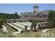 Beautiful community clubhouse with lawn bowling and stone accents throughout the manicured exterior at 340 Orbison Dr, Cary, NC 27519
