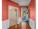 Bright foyer with hardwood floors and wainscoting leading into adjacent rooms at 340 Orbison Dr, Cary, NC 27519