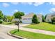 Charming single-story home featuring a two-car garage, well-manicured lawn, and inviting curb appeal at 340 Orbison Dr, Cary, NC 27519