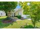 Charming home featuring manicured lawn, mature trees, and inviting covered front porch at 340 Orbison Dr, Cary, NC 27519