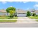 Inviting single-story home with a two-car garage, landscaped front yard, and classic design at 340 Orbison Dr, Cary, NC 27519
