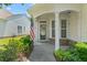 Inviting front porch with classic columns and decorative stone accents. A welcoming entryway! at 340 Orbison Dr, Cary, NC 27519