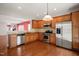 Well-equipped kitchen features stainless steel appliances, granite countertops, and hardwood floors at 340 Orbison Dr, Cary, NC 27519