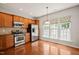 Bright kitchen featuring stainless steel appliances and ample cabinet space at 340 Orbison Dr, Cary, NC 27519