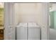 Convenient laundry area including a washer and dryer, with shelving above at 340 Orbison Dr, Cary, NC 27519