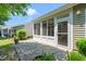 Enclosed patio perfect for outdoor relaxation, with views of the landscaped backyard at 340 Orbison Dr, Cary, NC 27519